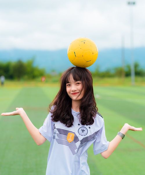Smiling person looking refreshed and energetic after a morning exercise session outdoors.